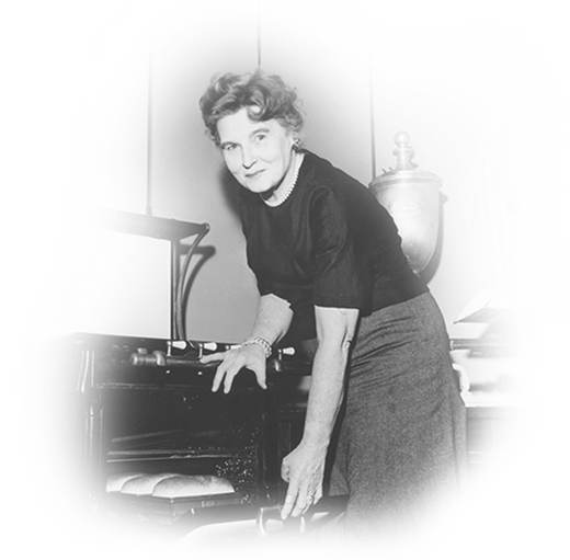 Historic photograph of Margaret Rudkin baking bread in a kitchen.